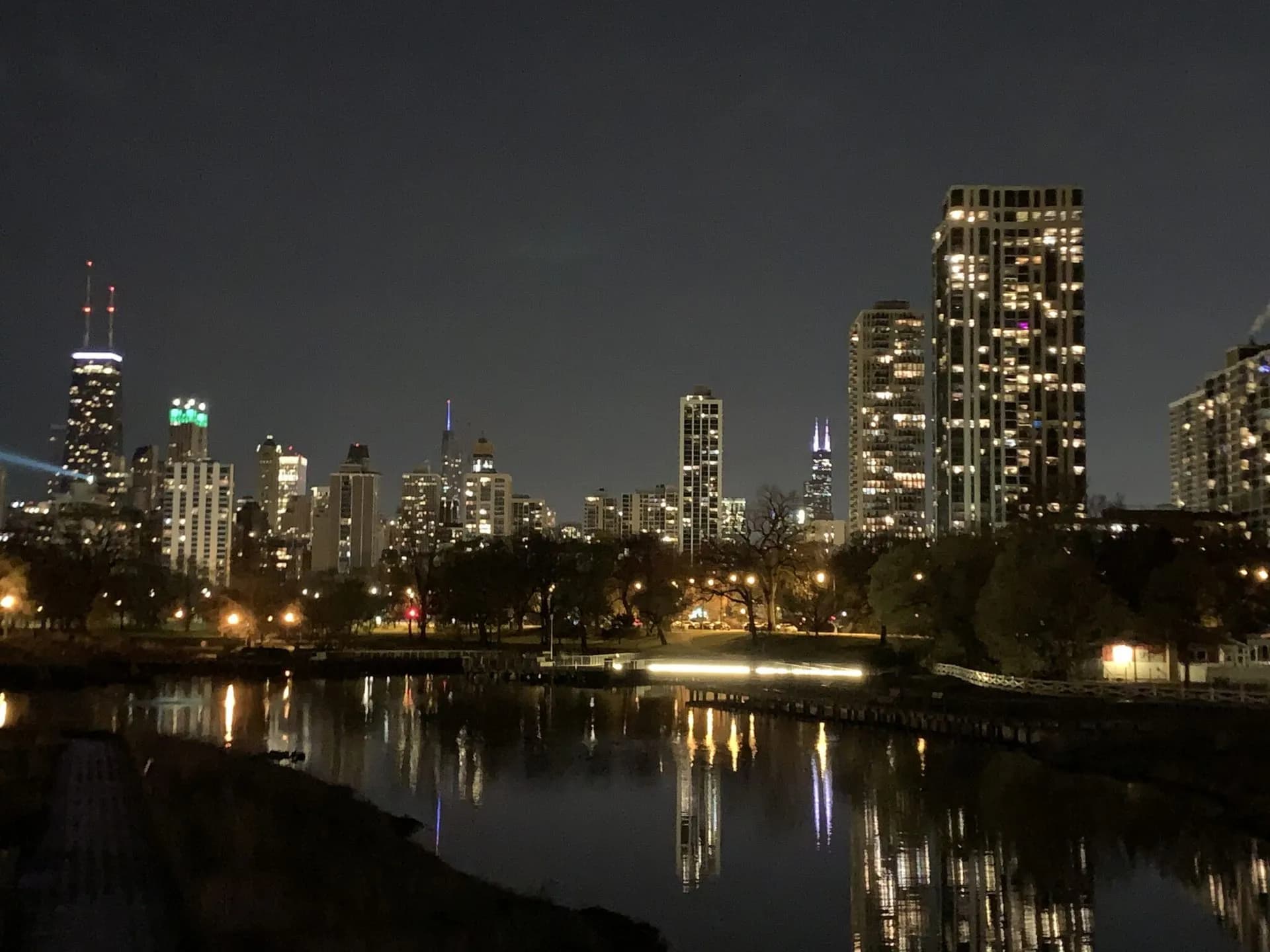 Chicago skyline reflected in the Lincoln Park Lagoon at night