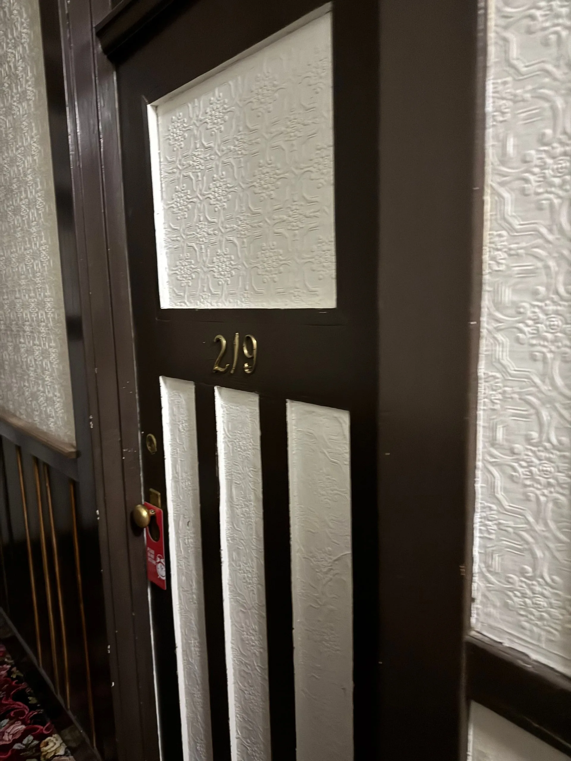 Room 219 at the Alaskan Hotel with a Do Not Disturb sign