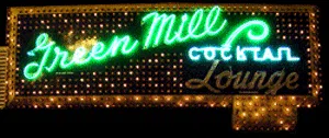 A neon sign for the green mill cocktail lounge