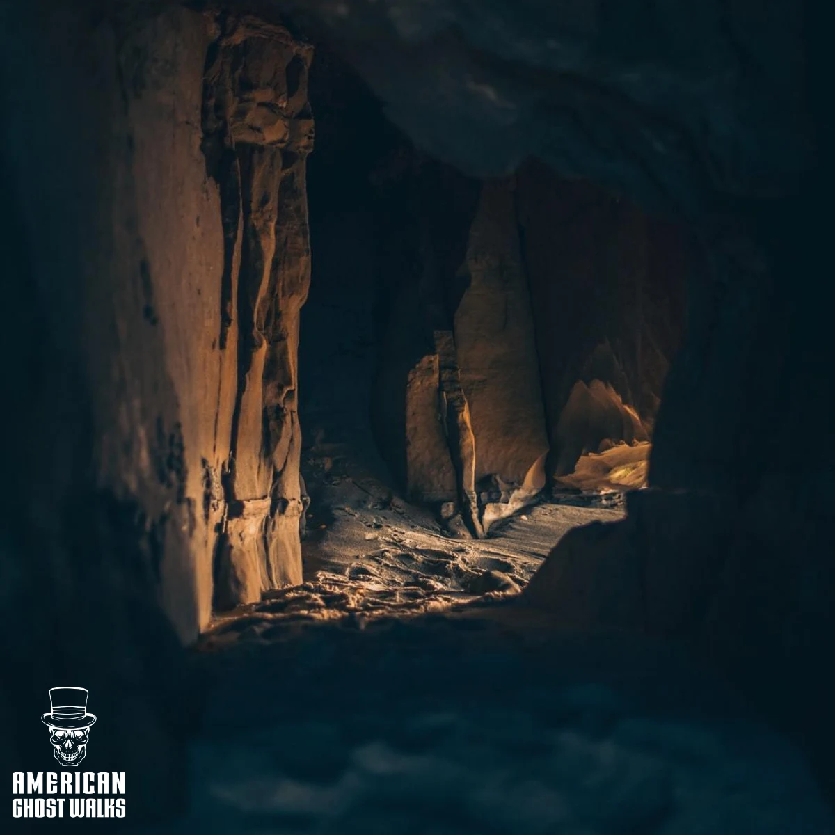 A dark cave with a light coming out of it.