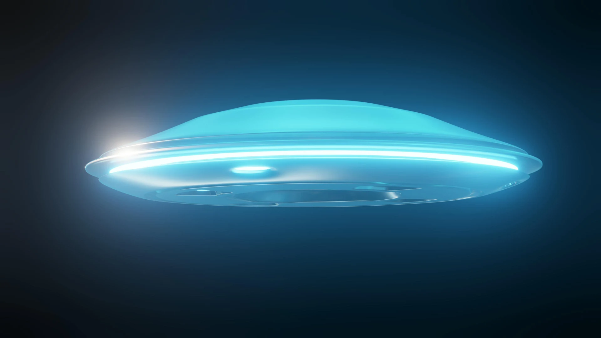 Blue, glowing UFO hovering against a dark background.