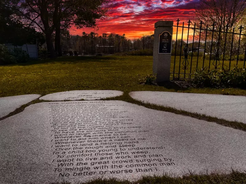 A stone walkway with a poem written on it