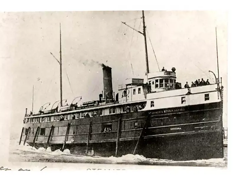 A black and white photo of a ship with the letter f on the side