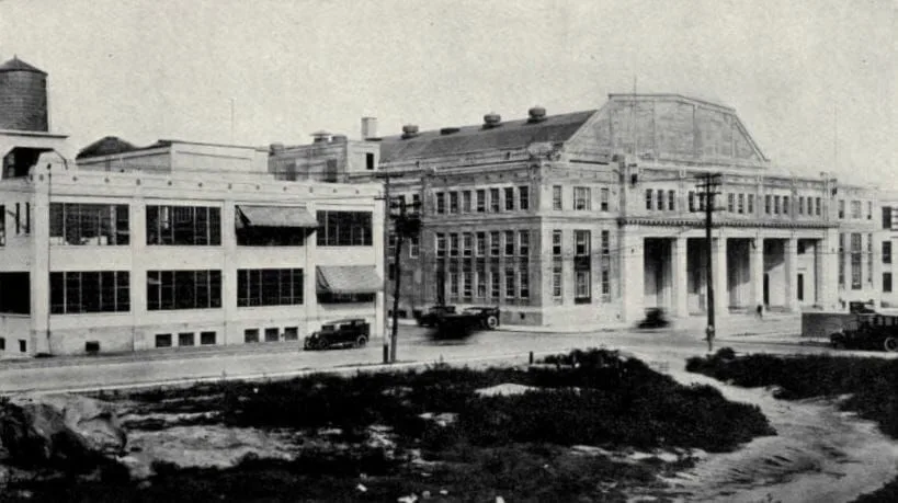 A black and white photo of a large building