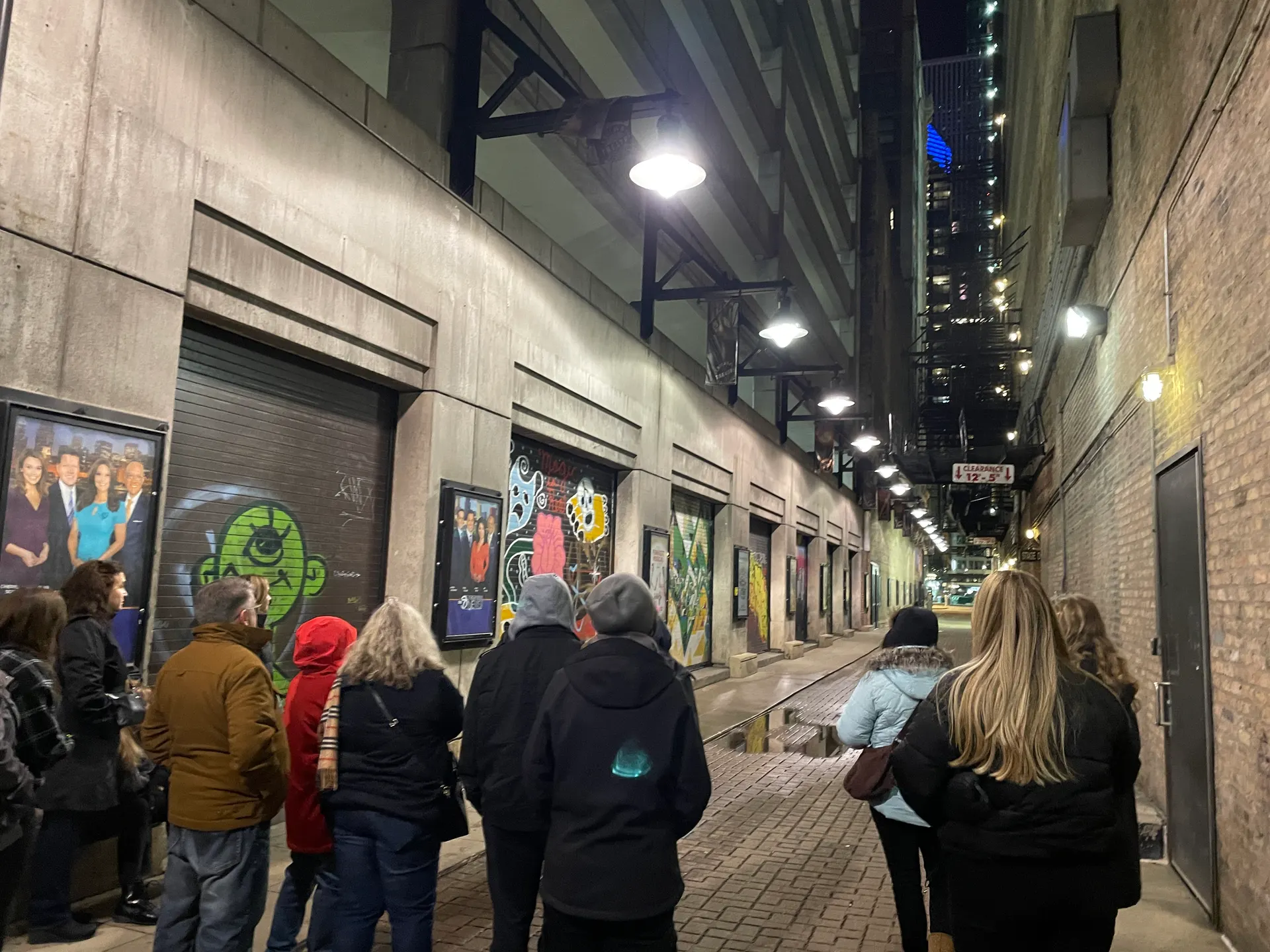 Guests gathered in the alley behind the Nederlander Theatre, site of the Iroquois Theatre Fire, on the Chicago ghost tour
