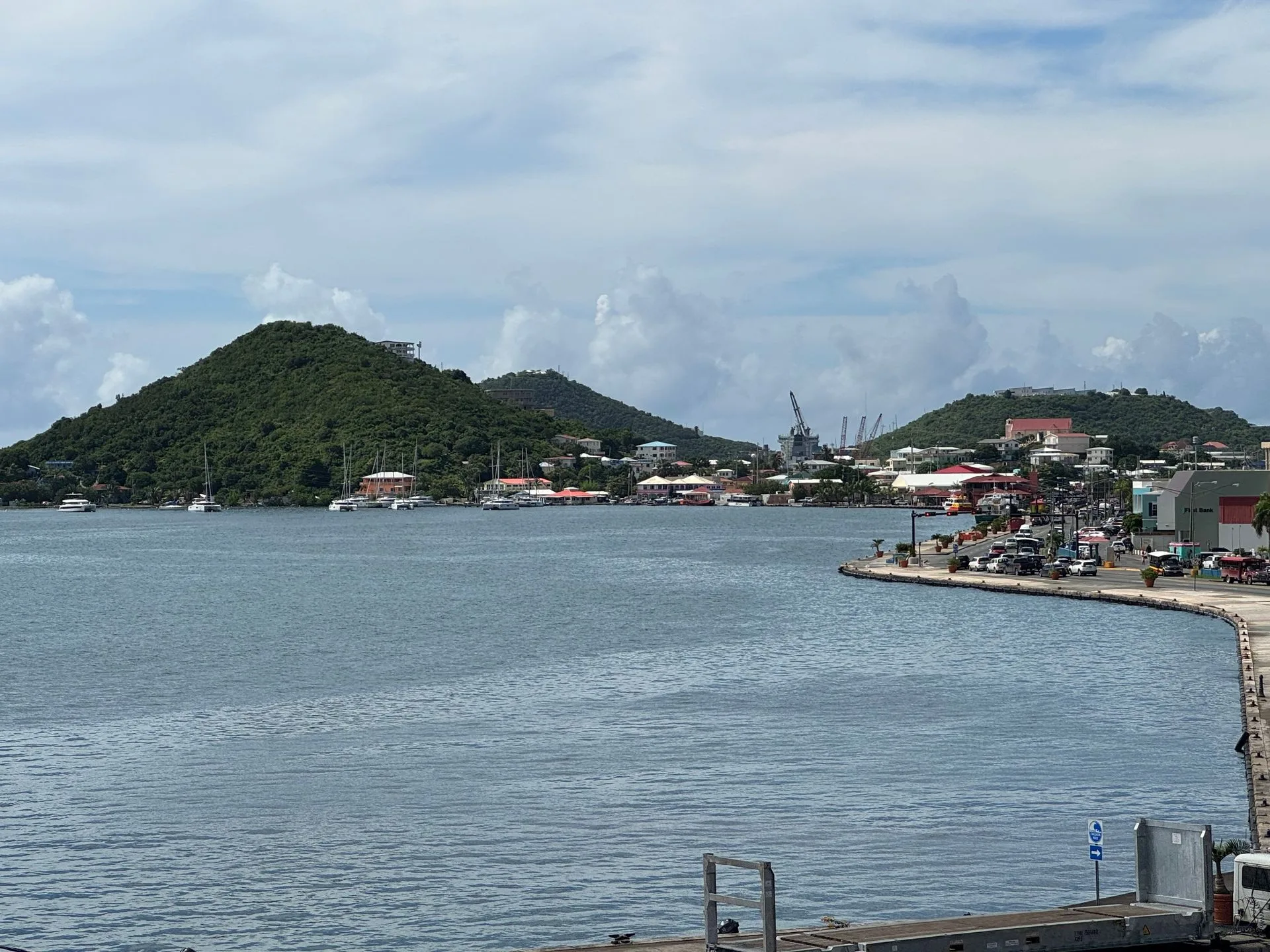 A large body of water with a mountain in the background